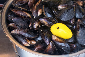 Fresh cooked mussels in shells with rice and lemon. Seafood, Turkish cuisine, street fast food.