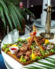 kebab set on desk and red wine