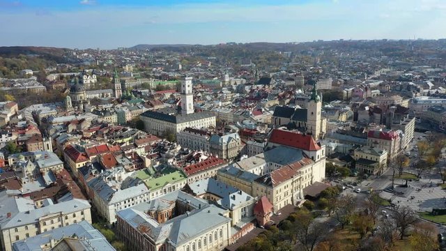 Aerial drone video of Lviv Old City center - roofs and streets, city hall Ratusha