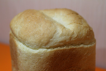 a loaf of homemade bread on an orange background