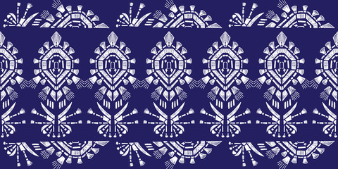 Drapery ikat navajo motif etnic white tribal ornamentalpattern on blue background. Surface background design for cotton fashion. Textile fabric ornament future rug.