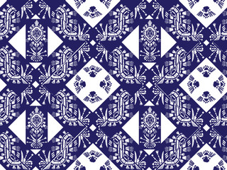 Fototapeta premium Drapery ikat navajo motif etnic white tribal ornamentalpattern on blue background. Surface background design for cotton fashion. Textile fabric ornament future rug.