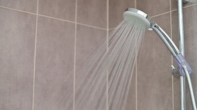 water flowing from shower in batheoom