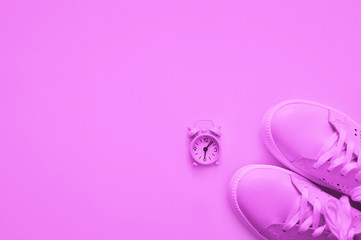 Neon color, light lilac sneakers and watches. Sport concept.flat lay style. Sport concept, Losing weight healthy lifestyle. Copy space.