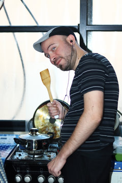 A friend dressed as a Gopnik (Russian street thug) making a soup.