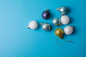 multi-colored Christmas toys on a blue background