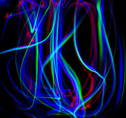 Multi Color Light Painting Photography Over Black Background. Nice blue abstract design. Star Wars...