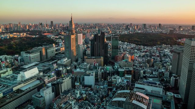 High angle view of Shinjuku station and Shinjuku district time lapse at sunset
