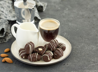 Handmade candies. prunes with chocolate almonds. Home sweetness. Selective focus.