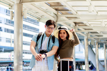 Portrait of Asian male and female tourists . Travel lovers concept