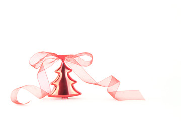 Isolated red Christmas tree bauble with red organza ribbon on white background