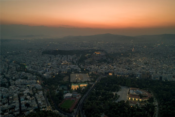 Aerial drone shot of Acropolis of Athens and its surroundings during sunset before evening