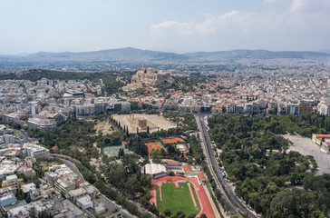 Aerial drone shot of Acropolis of Athens and Filopappou Hill, Zeus Olympion Temple and Zappeion