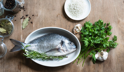 fresh dorade on wooden table