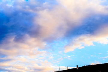 Dramatic puffy clouds at sunset