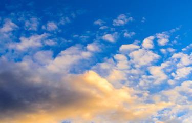 Dramatic puffy clouds at sunset