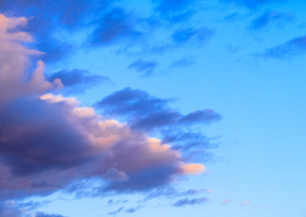 Dramatic puffy clouds at sunset