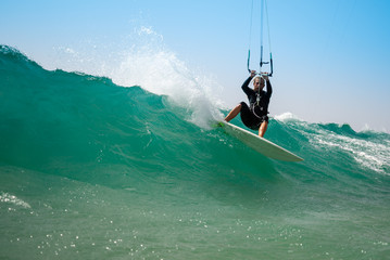 Obraz premium The kite surfer rides the waves of the Atlantic Ocean