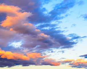 Dramatic puffy clouds at sunset