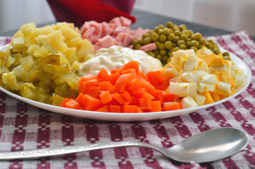 Home cuisine Olivier salad, closeup photo. To the festive table.