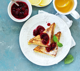 French toast with cherry sauce.