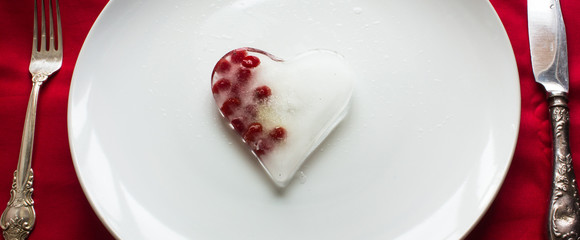 icy heart with berries on a white background. Valentine's Day postcard. Love concept for mother's day with space for text