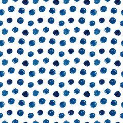 Hand-drawn watercolor seamless polka dot pattern in shades of indigo blue.