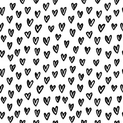 Hand-drawn seamless pattern with doodle hearts.