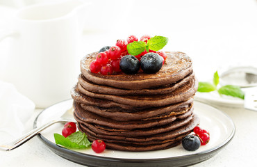 Chocolate pancakes with berries.