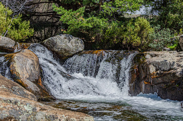 Water cascade between rocks. saw of guadarrama. Madrid. Spain