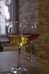 White and red wine in the glasses of a cafe