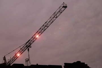 boom construction crane against the night sky. work at night