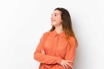 Obraz premium Young brunette girl over isolated white background happy and smiling
