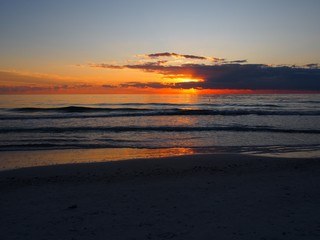 The End of the Sunset and its Reflection in the Gulf of Mexico