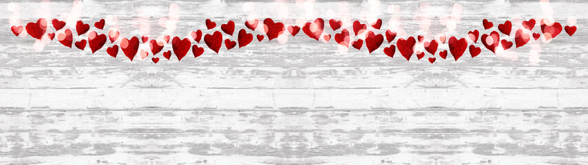Valentine love background panorama banner long -Red hearts and white bokeh lights isolated on rustic white bright shabby vintage texture. top view with space for text