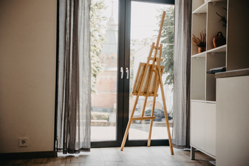 Empty artist's workshop with a painting on an easel