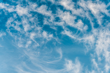 Beautiful pastel colored puffy clouds at sunset