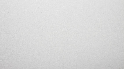 White concrete wall.Water-based paint background.The texture of the white painted walls.