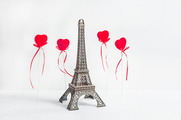 Paris travel destinations concept; The Eiffel tower and red hearts on the white background