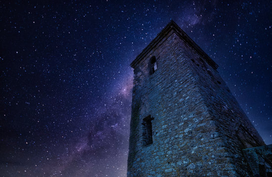 Magical Landscapes of the stars and the milky way with mountains and waterfalls with winter scenics for wallpaper backgrounds.