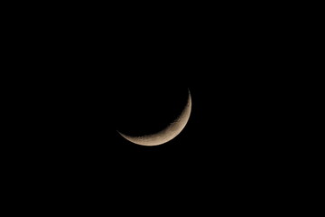 Fototapeta na wymiar Moonset 16.5% in dark sky background, taken time 18.31 pm.