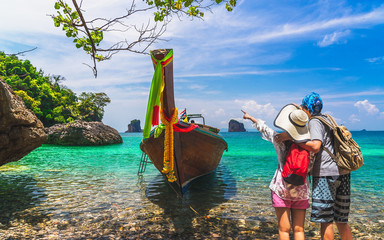 Joyful couple traveler stand on nature clear blue sea water with boat, Travel Krabi Phuket Thailand fun beach, Tourist people on summer holiday vacation trips, Tourism beautiful destination place Asia © day2505