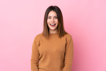 Obraz premium Young woman over isolated pink background with surprise facial expression