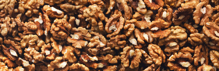 Peeled walnuts. Background. Texture. Panorama.