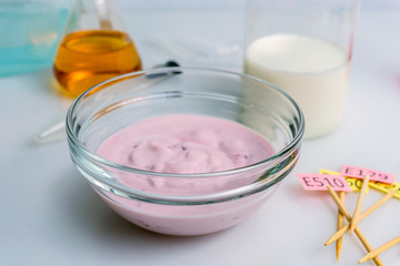 Food quality control inspecting at additives yogurt and milk in the laboratory. Close up.