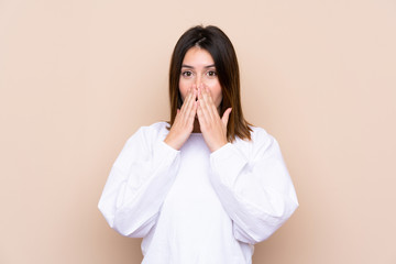 Young woman over isolated background with surprise facial expression