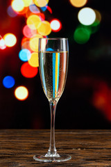 glass of champagne on bokeh background