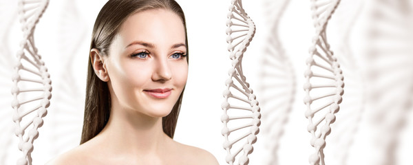 DNA stems and beautiful young woman over light blue background.