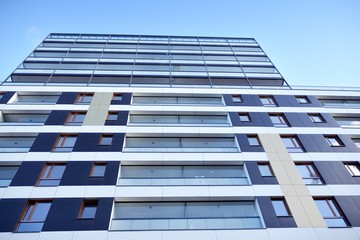Fragment of modern residential apartment with flat buildings exterior. Detail of new luxury house and home complex. 