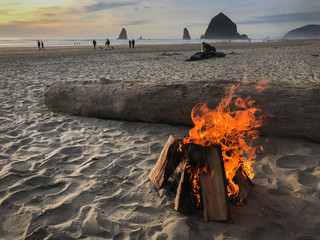 Flaming beach bonfire on Oregon coast near Haystack Rock in Cannon Beach